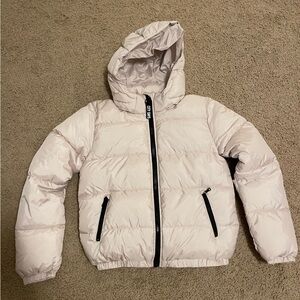 Girls Cream colored short puffer jacket.